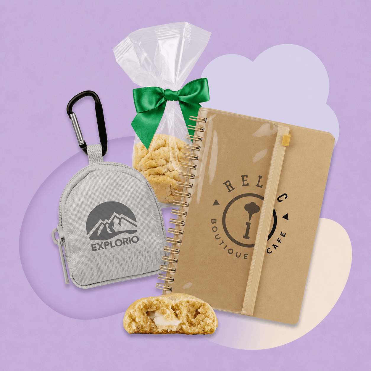 A branded mini backpack with carabiner clip, a wrapped cookie, and a kraft notebook — examples of micro moment corporate gifts